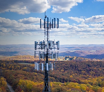 Drone inspecting telecommunications tower